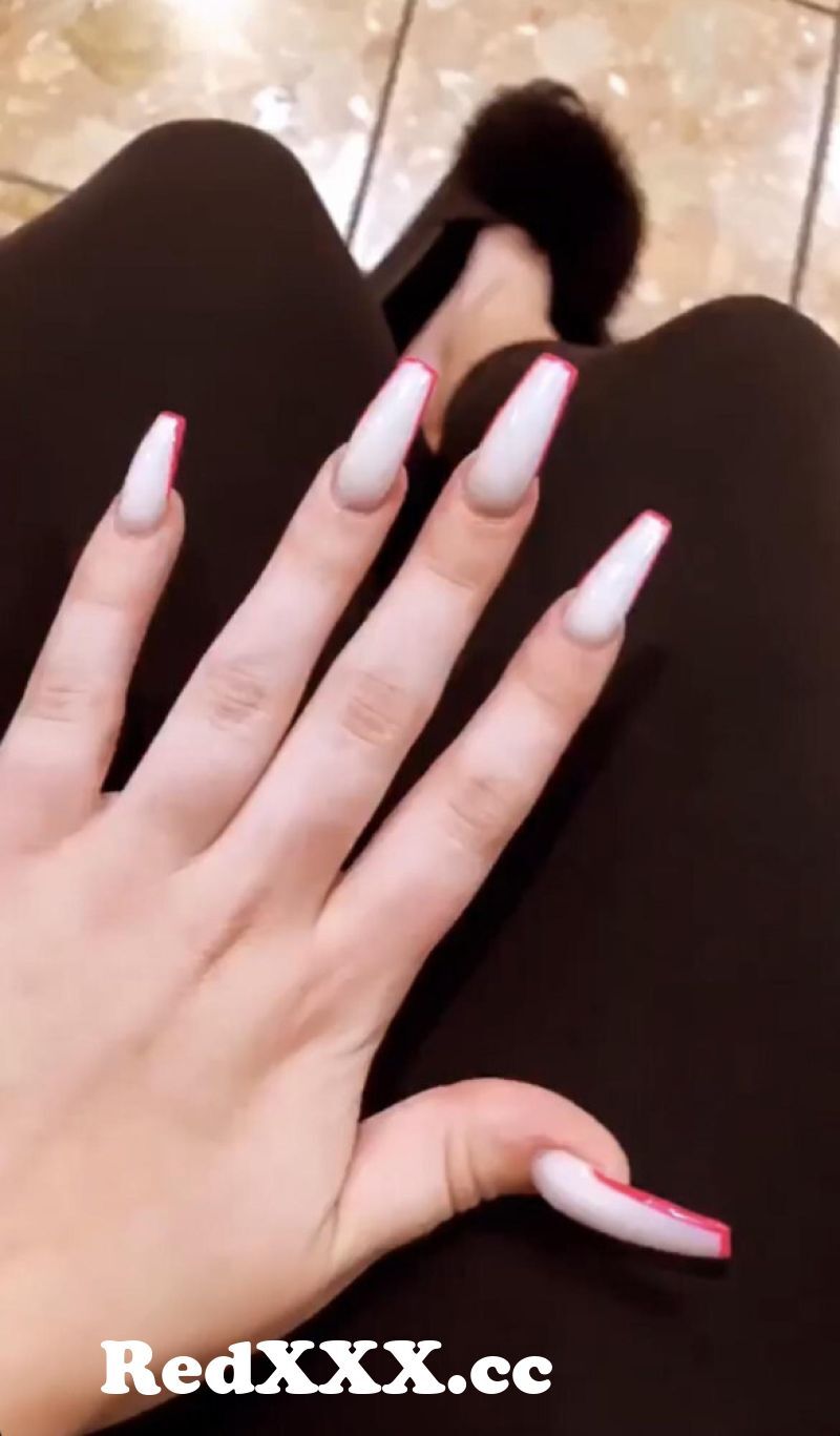 Fingers and a long white fake dong
