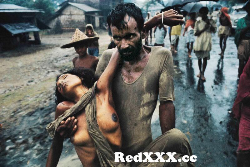 View Full Screen: a refugee from east pakistan carrying his cholera stricken wife arriving in india during the bangladesh genocidewhich w.jpg